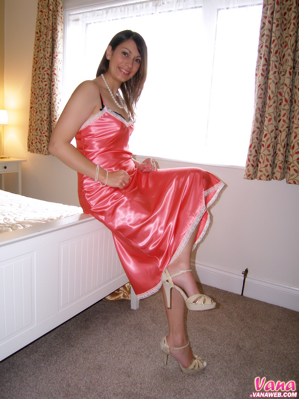 Vana wears a hot pink satin and black... 