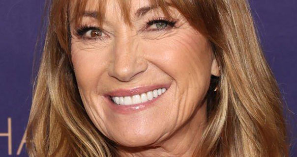 Jane Seymour smiles with her hair loose around her face. She appears in front of a purple background with gold lettering.